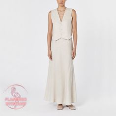 It features an V neckline and a centre back split to allow for movement. Style yours as a set with the Long Skirt or with high-rise jeans. With a timeless design and meticulous attention to detail, our linen set vest is a versatile wardrobe staple that promises to keep you looking sharp and stylish for any occasion. Explore the epitome of refined fashion with this must-have piece. 🖤 DETAILS Centre front buttons V neck Invisible side zipper Maxi skirt 🖤 SIZE XS Bust: 33.5" / 84cm Waist: 26" / 6 Fitted Linen Maxi Skirt, Elegant Linen Flared Maxi Skirt, Beige Linen Maxi Skirt For Spring, Elegant Fitted Linen Maxi Skirt, Chic Beige Linen Maxi Skirt, Fitted Linen Long Skirt, Elegant Beige Linen Skirt, Linen Fitted Skirt For Daywear, Elegant Linen Daywear Skirt