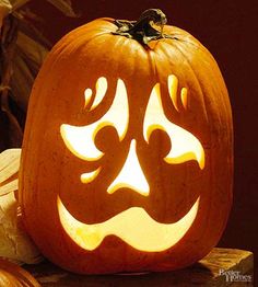 a carved pumpkin with an evil face on it