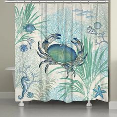 a shower curtain with blue crabs and seaweed