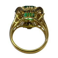 18K yellow gold ring with emerald stone and diamonds.    Sophia D by Joseph Dardashti LTD has been known worldwide for 35 years and are inspired by classic Art Deco design that merges with modern manufacturing techniques. Luxury Gold Emerald Ring With Halo Setting, Emerald Ring With Rose Cut Diamonds For Formal Occasions, Formal Yellow Gold Tsavorite Rings, Gold Tsavorite Emerald Ring For Formal Occasions, Formal Gold Emerald Ring With Tsavorite, Luxury Green Emerald Ring With Rose Cut Diamonds, Luxury Gold Emerald Ring With Prong Setting, Gold Emerald Ring With Diamond Accents, Luxury Green Emerald Hallmarked Ring