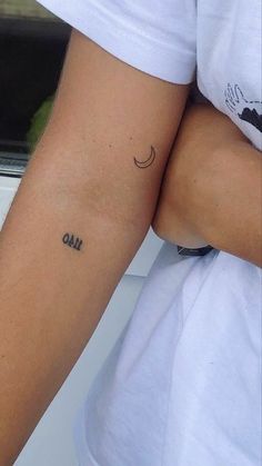 a person with a small tattoo on their arm