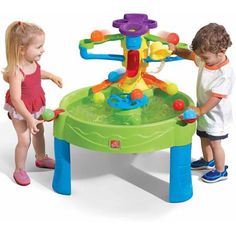 two children playing with a toy water table