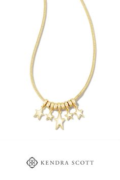 Take your look to the next level with the Ada Star Necklace in Gold. Blending a classic chain with modern, metallic star charms, this statement is sure to bring the shine to your collection year-round. Trendy Metal Charm Necklace With Star Charm, Trendy Metal Chain Necklace With Star Charm, Metal Star Charm Necklace In Star Shape, Jewelry Wishlist, Double Band Rings, Sold Out Sign, Star Jewelry, Gold Pendant Necklace, Star Charms