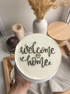 a cake with the words welcome home written on it