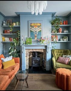 a living room with two couches and a fire place in the middle of it