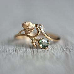 Fairy Inspired Wedding Rings, Wedding Ring Nature Inspired, Plant Inspired Engagement Rings, No Traditional Wedding Rings, Plant Engagement Ring, Elven Engagement Rings, Lotr Inspired Engagement Rings, Four Leaf Clover Ring, Nature Themed Engagement Rings