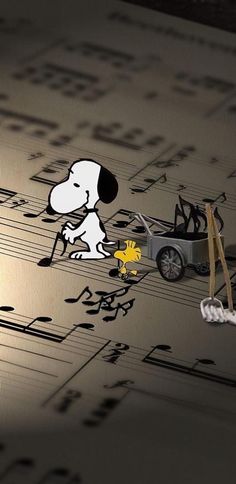 an image of a dog and car on sheet music