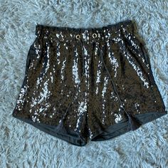 Nwt, Tried On But Never Worn. Black Sequin Shorts With Elastic Waist And A Casual Loose Fit Through The Legs. Sequin Shorts For Night Out, High Waist Sequin Shorts For Night Out, High-waist Sequined Shorts For Night Out, Trendy Short Sequined Bottoms, Party Pants With Built-in Shorts, Stretch Sequined Short Bottoms, Sequined High-waisted Shorts For Night Out, Short Stretch Sequined Bottoms, Casual Party Shorts With Sequins