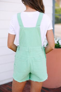 Who doesn't love a pair of cute overall for the summer! These in particular are truly adorable! We love their coloring and those causal raw hems. These overalls features pockets, raw hems, and a classic fit. Material has a fair amount of stretch.Sydney is wearing the small. Green Dungarees Outfit, Green Dungarees, Dungarees Outfit, Dungaree Outfit, Mint Julep Boutique, Mint Julep, Model Fits, Denim Overalls, Personal Marketing