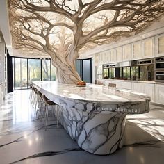 a large kitchen with marble counter tops and an enormous tree in the middle of it