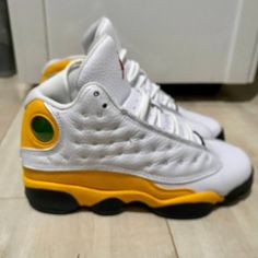 This Pair Of Air Jordan 13 Retro Sneakers In The Del Sol White Gold Colorway Is A Must-Have For Any Sneakerhead. The Shoes Are Gently Preowned And Come In A Size 4 Youth, Equivalent To A Women's Size 5.5 Or A Men's Size 4. The Mid-Top Sneakers Feature A Lace-Up Closure And Standard Width. The Shoes Are Perfect For Activewear Occasions And Have A Multicolor Design. The Air Jordan 13 Retro Sneakers Are Part Of The Iconic Air Jordan Product Line And Bear The Jordan Brand Name. They Were Manufactured In Indonesia And Are Not Signed Or Vintage. These Athletic Shoes Are Not Customized And Are Ready To Wear. Don't Miss Out On The Opportunity To Own A Piece Of Sneaker History. Used But Jordan Gold, Air Jordan 13 Retro, Mid Top Sneakers, Jordan 13 Retro, Jordan 13, Mid Top, Retro Sneakers, Heads Up, Jordans For Men