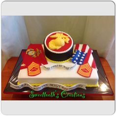 a cake that is sitting on top of a table with an american flag and eagle