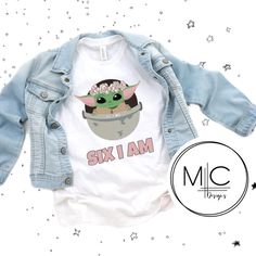 a baby yoda shirt with the words six i am printed on it, next to a denim jacket