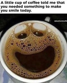 a cup of coffee that has been made to look like a smiley face