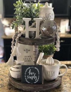 a kitchen counter with coffee cups and mugs stacked on top of eachother