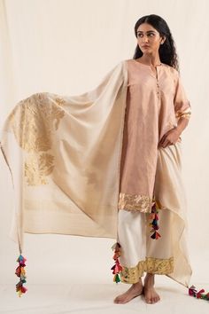 Moonga ivory silk brocade dupatta with floral motif and multi color tassels. - Aza Fashions Chanderi Dupatta With Latkans In Traditional Drape, Traditional Chanderi Dupatta With Latkans, Festive Chanderi Dupatta With Latkans, Traditional Silk Dupatta With Tassels, Silk Dupatta With Tassels In Traditional Style, Cream Silk Dupatta For Navratri, Festive Silk Dupatta With Tassels, Festive Beige Tussar Silk Dupatta, Transitional Festive Dupatta With Latkans