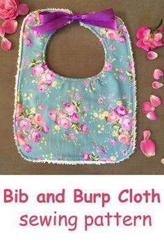 a bib and burp cloth sewing pattern with pink flowers on it, next to a purple ribbon