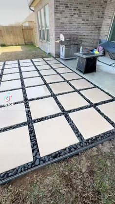 an outdoor patio that has been laid out on the grass and is ready to be installed