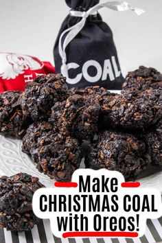 homemade christmas coal cookies with oreos on a white plate next to a black bag