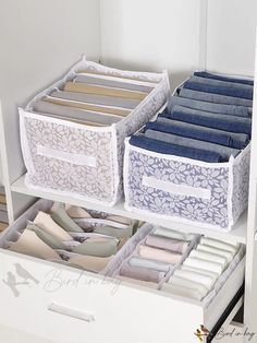 the drawers are organized with folded clothes