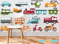 a child's room wall with cars and trucks painted on the wall, along with a chair