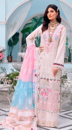 "Soft crepe pink blooms with intricate floral embroideries in 'Saiqa.' A quintessentially feminine design, it's paired with a tonal trouser and a striking dupatta in shade of complimenting taffy and a contrasting sky blue. This classic look will never go out of style. Paste Printed Woven Dupatta Embossed Printed 4 sided Dupatta Patti Embroidered Lawn Front Schiffli Jall Embroidered Lawn Back Spray Embroidered Lawn Sleeve Spray Embroidered Neckline Embroidered Front Motif Patch Embroidered Front Semi-stitched Pink Lawn Suit With Dabka Work, Pink Anarkali Lawn Suit With Intricate Embroidery, Pink Georgette Lawn Suit With Chikankari Embroidery, Pink Embroidered Georgette Lawn Suit, Festive Pink Georgette Lawn Suit, Designer Pink Resham Embroidered Fabric, Pink Embroidered Kurta For Eid, Designer Pink Fabric With Resham Embroidery, Pink Resham Embroidered Designer Fabric