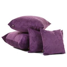 three purple pillows stacked on top of each other