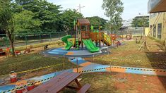 children's play area with slide and climbing equipment