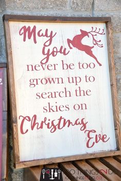 a wooden sign that says, may you never be too grown to search the skies on christmas eve