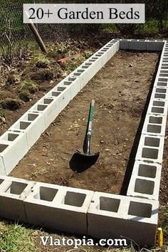 the garden bed is being built with concrete blocks