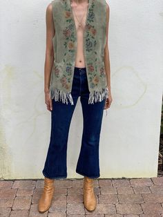 "Suede hand-stenciled floral fringe vest by Patricia Wolf. Bust: 36\" Length: 93\" Circa: 1980's Condition: Good vintage condition. Normal wear. Typical spots, marks, discoloration.. Follow us on Instagram for the latest----> http://instagram.com/closetcasevintage @closetcasevintage Please read our store policies." Vintage Spring Vest Outerwear, Spring Sleeveless Vest With Tassels, Sleeveless Tassel Vest For Spring, Vintage Sleeveless Outerwear For Festivals, Fitted Fringe Vest For Spring, Fall Sleeveless Vest With Tassels, Bohemian Fringe Vest For Spring, Vintage Denim Vest For Fall Festival, Vintage Denim Vest For Festival In Fall