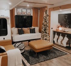 a living room filled with furniture and christmas decorations