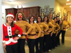 a group of women dressed up as santa clause