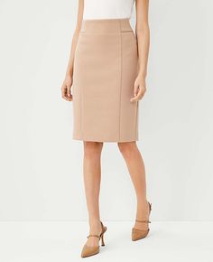 Elevate your office wardrobe with the Ann Taylor Tall High Waist Seamed Pencil Skirt in a chic Natural Camel shade. This skirt combines style and comfort, crafted from a blend of 78% polyester, 15% viscose, and 7% spandex, ensuring a stretchy yet form-fitting silhouette that resists wrinkles throughout the day.

- **Color:** Natural Camel
- **Material:** Polyester, Viscose, Spandex
- **Size:** 4 (Tall)
- **Gender:** Female
- **Features:** High waist, seamed detailing, hidden back zipper with hoo Office Wardrobe, Tweed Pencil Skirt, Knitted Suit, High Waisted Pencil Skirt, Office Attire, Pencil Skirts, Double Knit, Double Knitting, Polished Look