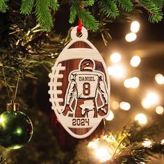 a wooden ornament hanging from a christmas tree