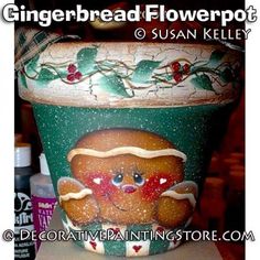 there is a flower pot with a painting on it's side and the words gingerbread flowerpot above it