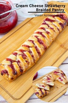 cranberry braided pastry on a cutting board with jelly spread around the edges