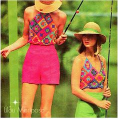 two women in swimsuits and hats standing next to each other with fishing rods