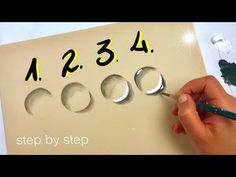 someone is drawing numbers on a piece of paper