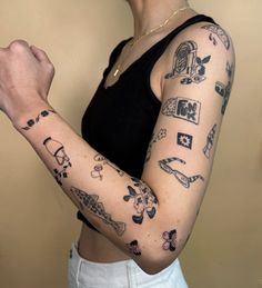 a woman with many tattoos on her arm