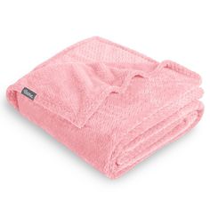 a pink blanket folded on top of each other