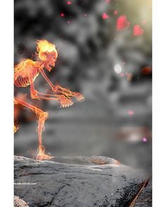 the skeleton is dancing on fire with his arms outstretched