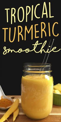 tropical turmeric smoothie recipe in a jar on a cutting board next to sliced bananas