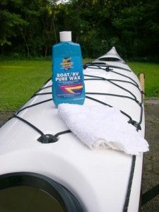 a bottle of soap sitting on top of a kayak