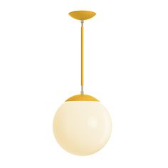 a white and yellow light hanging from a ceiling fixture with a metal rod in the center