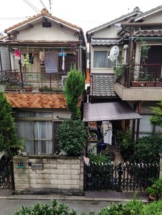 an apartment building with two balconies on the second floor and balcony above it