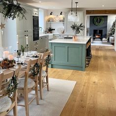 a kitchen filled with lots of counter top space next to a dining room table and chairs