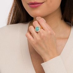 Expect to turn heads when you wear this captivating blue chalcedony and white topaz frame ring. Crafted in sterling silver with 14K gold plate This choice showcases a tilted 12.0mm cushion-shaped soft-blue chalcedony cabochon. Multi-sized white topaz embrace the center stone in shimmer. The rope-textured double-row shank adds further eye-catching detail. The inside of the shank is rounded for comfort. Elegant Turquoise Opal Ring With Gemstone, Elegant Turquoise Opal Gemstone Ring, Elegant Chalcedony Opal Ring For Anniversary, Elegant Chalcedony Opal Ring, Elegant Turquoise Opal Ring, Frame Ring, Blue Chalcedony, White Topaz, Topaz