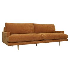 a brown couch sitting on top of a white floor