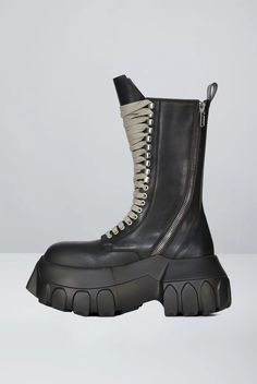 Rick Owens' Fall/Winter 2024 Army Mega Tractor Boots rise to mid-calf with dual curved zippers, wraparound lacing, and a commanding double-height sole. Cargo Coat, Charlotte Chesnais, Double Height, Scarf Shirt, Shirts For Leggings, Fall Winter 2024, Cape Coat, Marine Serre, Jeans Jumpsuit